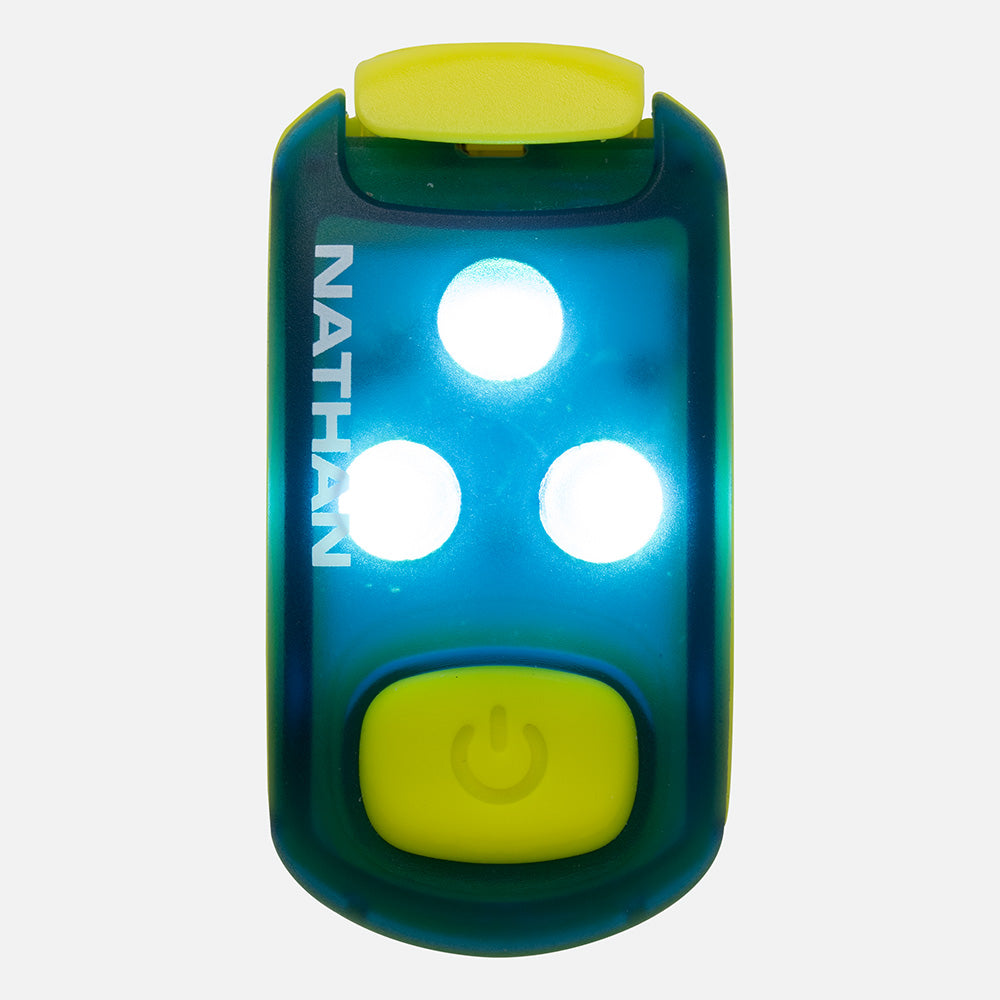 Compact LED safety light with three bright white lights and yellow clip attachment