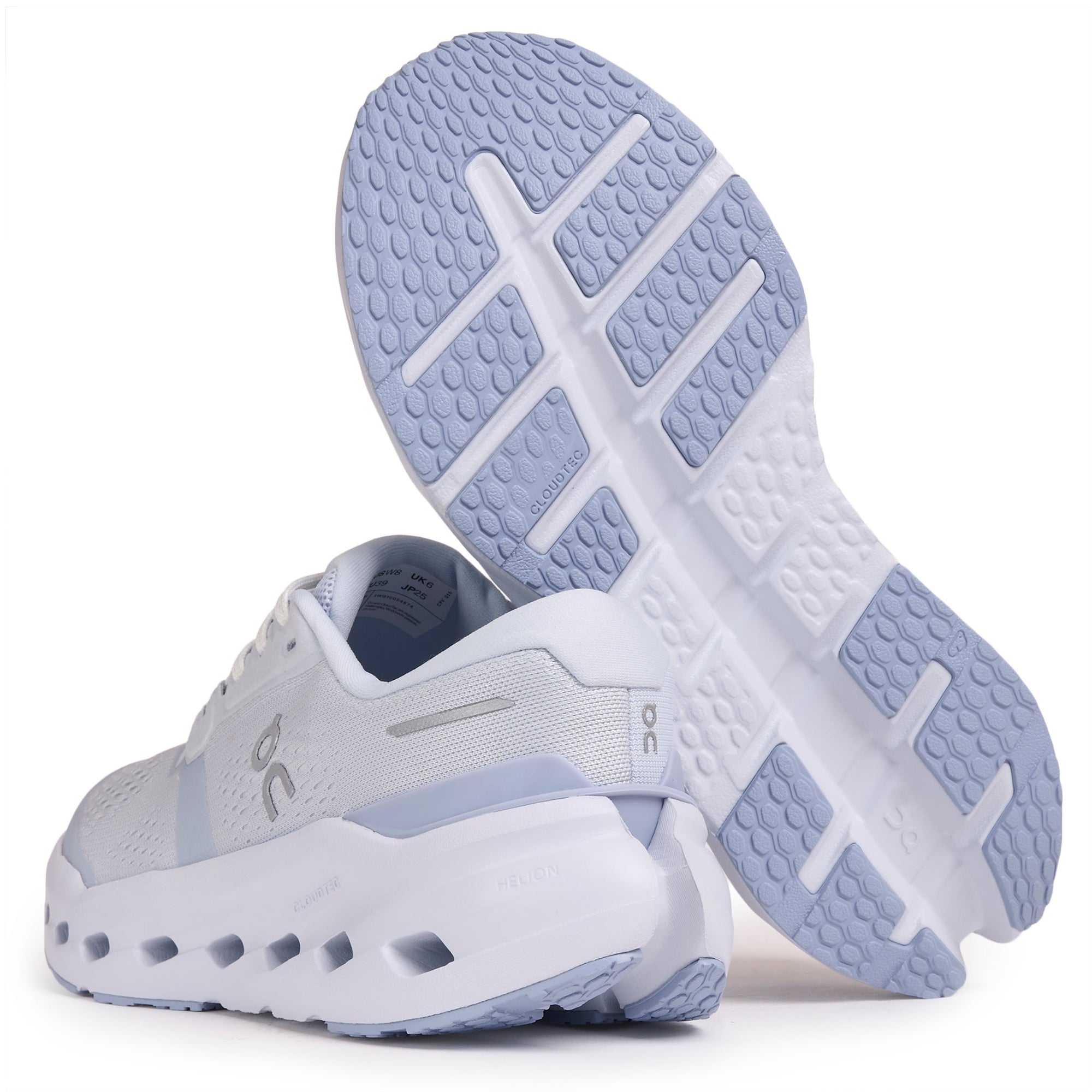 Light gray and white running shoes with perforated sole, shown from side and bottom view