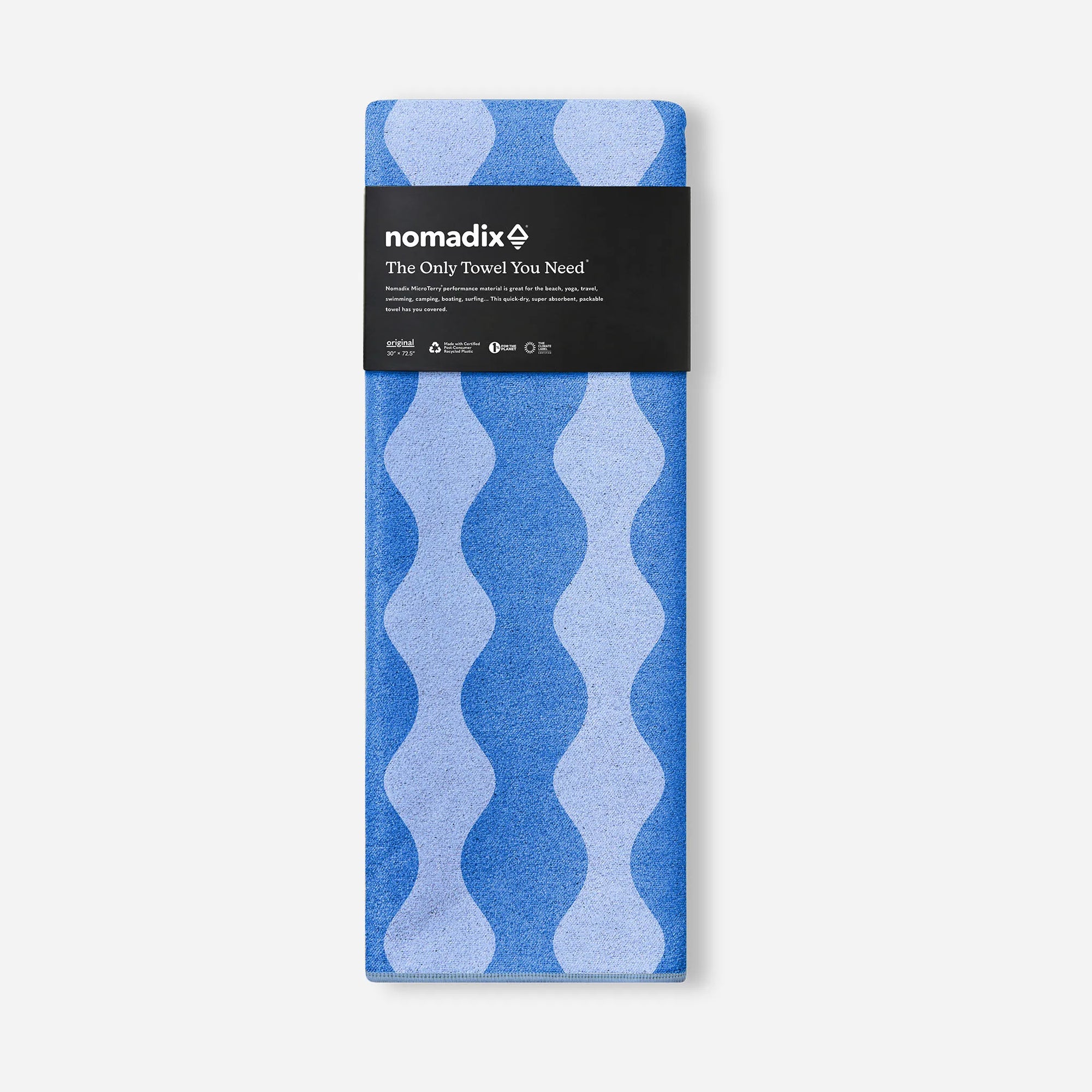 Packaged blue patterned towel with wavy design in product packaging