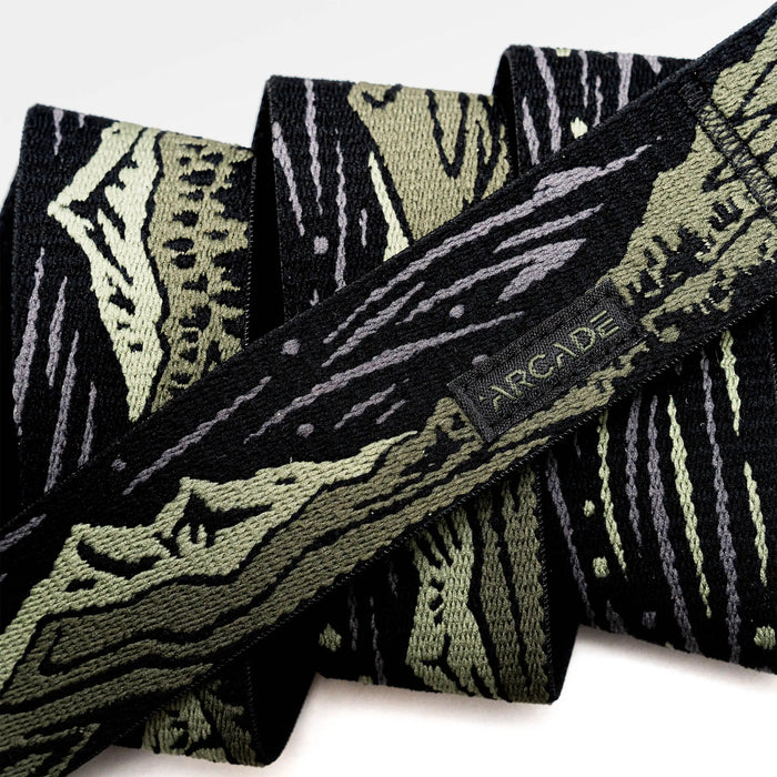 Patterned adventure belt with geometric design in dark green, black and white colors