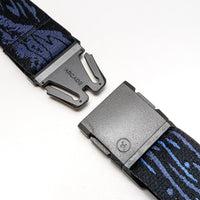 Adventure belt with navy blue patterned webbing and gray metal buckle shown unbuckled