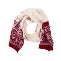 Knit scarf with cream center and red Nordic Fair Isle pattern on both ends, loosely coiled