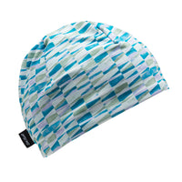 Fitted beanie hat with teal, green, and lavender geometric brushstroke print, three-quarter view