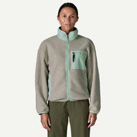 Women's fleece zip jacket with mint green contrast collar and chest pocket, front view on model