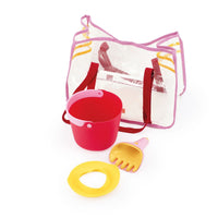 Beach toy set with red bucket, yellow shovel and ring toy in transparent mesh bag