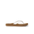 White flip-flop sandal with textured strap and brown footbed, side profile view