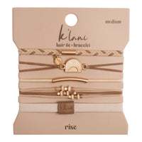 Set of five hair tie bracelets in beige and gold tones on branded packaging card