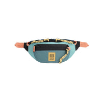 Light blue waist pack with front zip pocket and adjustable strap, front view