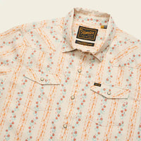 Men's western snap shirt in floral stripe pattern with pearl snaps, chest pockets, angled front view