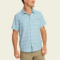 Light blue checkered short-sleeve button-up shirt with chest pockets, front view on male model