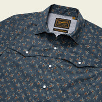 Dark blue button-up shirt with small floral print, angled front view showing collar and chest pockets