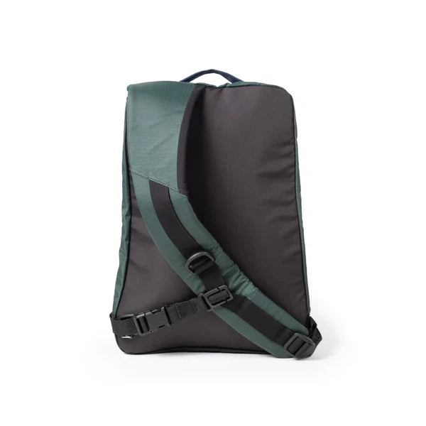 Sling bag with forest green and black panels, adjustable straps, shown from back angle