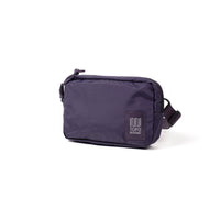 Deep purple ripstop belt bag with zipper closure and adjustable strap, angled view