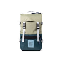 Olive green and dark teal backpack with white straps and buckles, front view