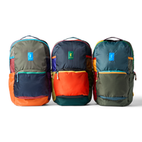 Three colorblock backpacks with front zip pockets and carry handles, shown in group shot