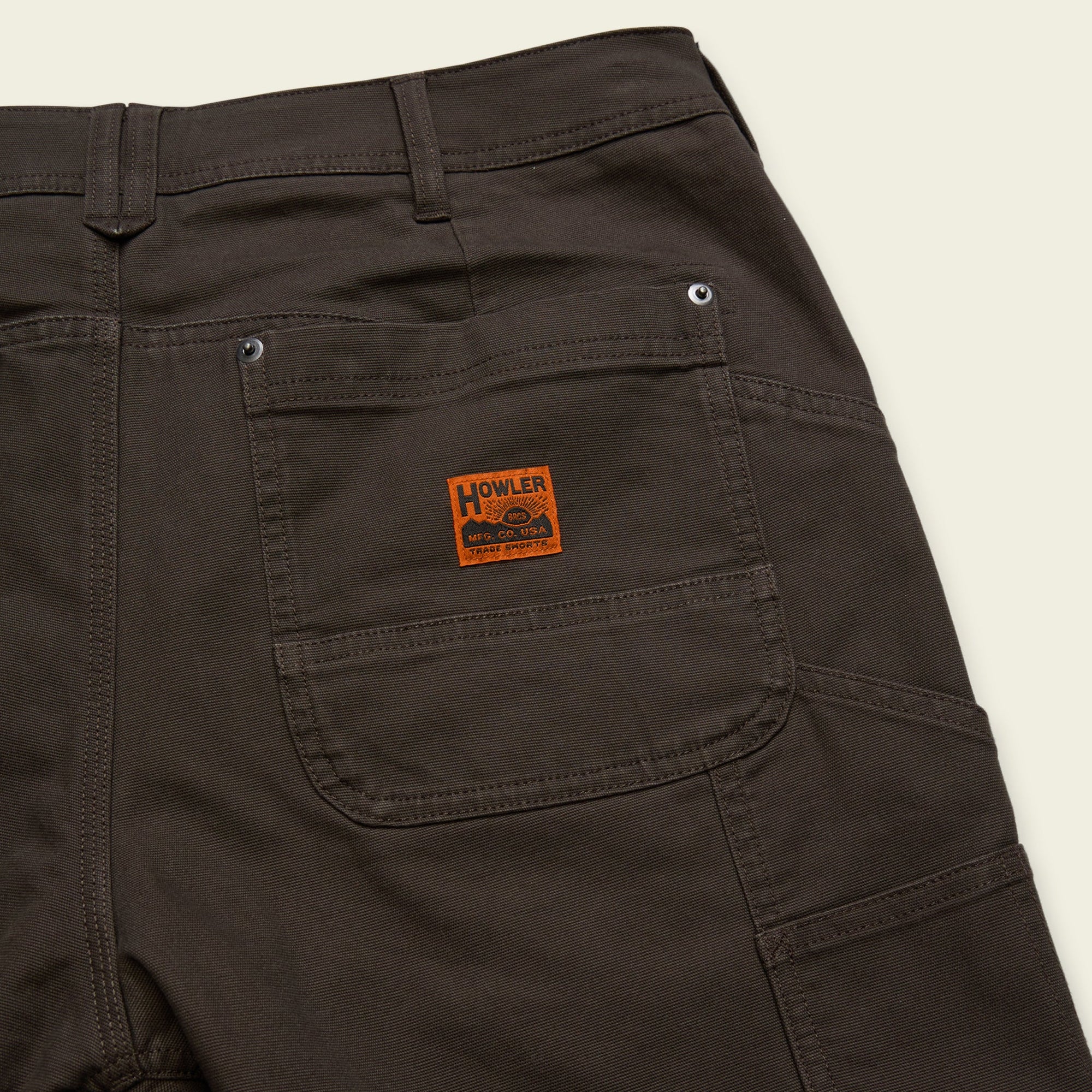 Olive-brown work shorts with cargo pockets and utility belt loops, back detail view
