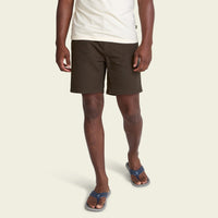 Dark olive green shorts with cargo pockets, worn with blue flip-flops, front view