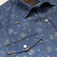 Close-up detail of floral print western snap shirt with chest pocket and silver snap buttons