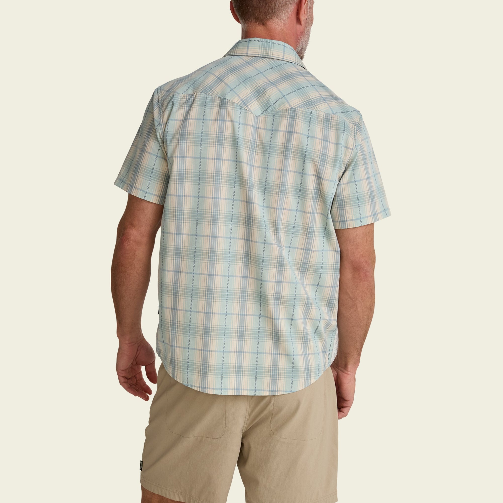 Men's short-sleeve plaid snap shirt, back view, light cream with blue plaid pattern