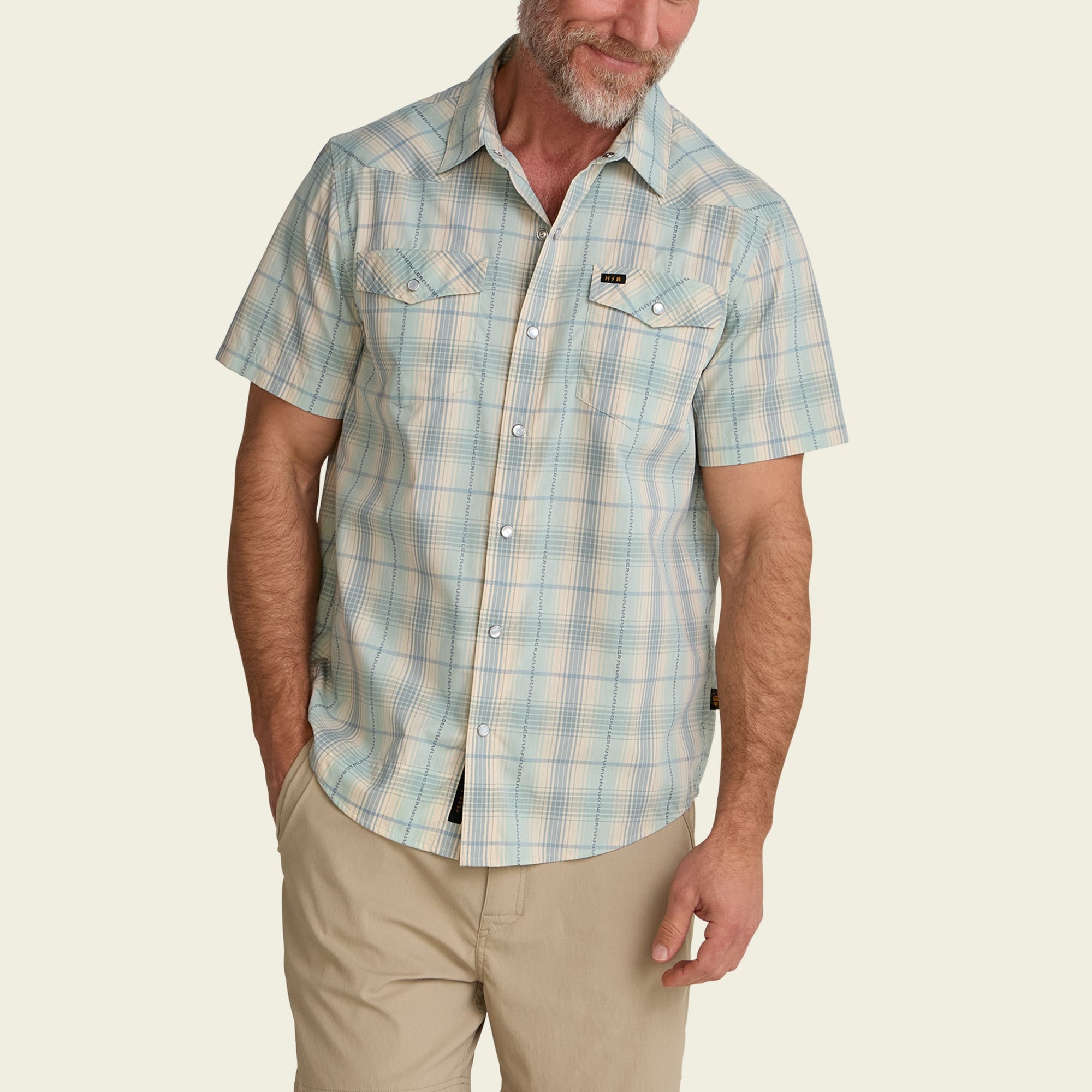 Men's short-sleeve plaid snap-button western shirt with chest pockets, front view on model