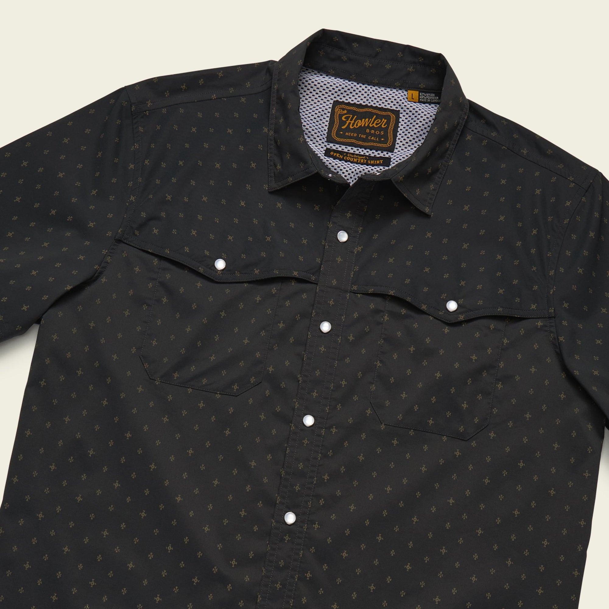 Black western-style shirt with small star pattern, snap buttons and chest pockets