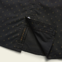 Dark button-up shirt with small star pattern, showing collar detail and chest pocket