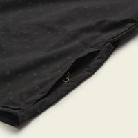 Black button-up shirt with small star pattern, detail view showing chest pocket with zipper