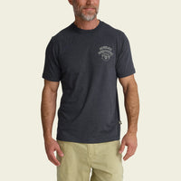 Dark navy heathered t-shirt with small chest logo worn by bearded man