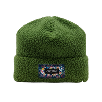 Green sherpa fleece cuffed beanie with branded patch on front cuff, flat lay view