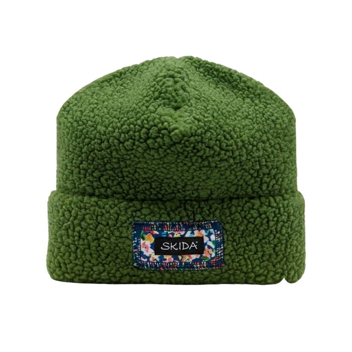 Green sherpa fleece cuffed beanie with branded patch on front cuff, flat lay view