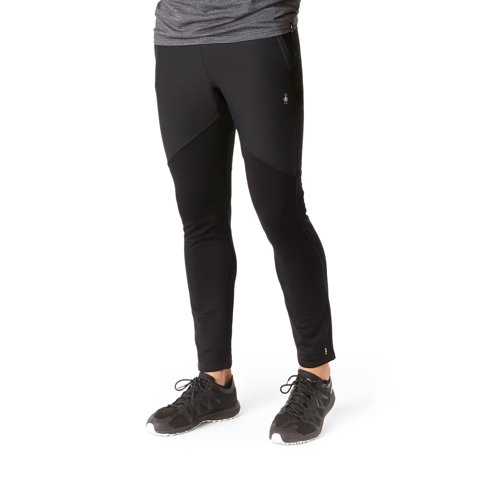 Black men's fitted wind pants with paneled construction, front view on model