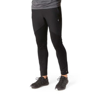 Black men's fitted wind pants with paneled construction, front view on model