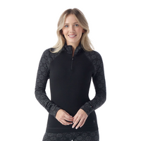 Women's long-sleeve quarter-zip base layer with black body and patterned fair isle sleeves, front view