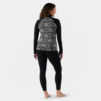 Women's thermal base layer quarter zip, back view, black with geometric fair isle print panel