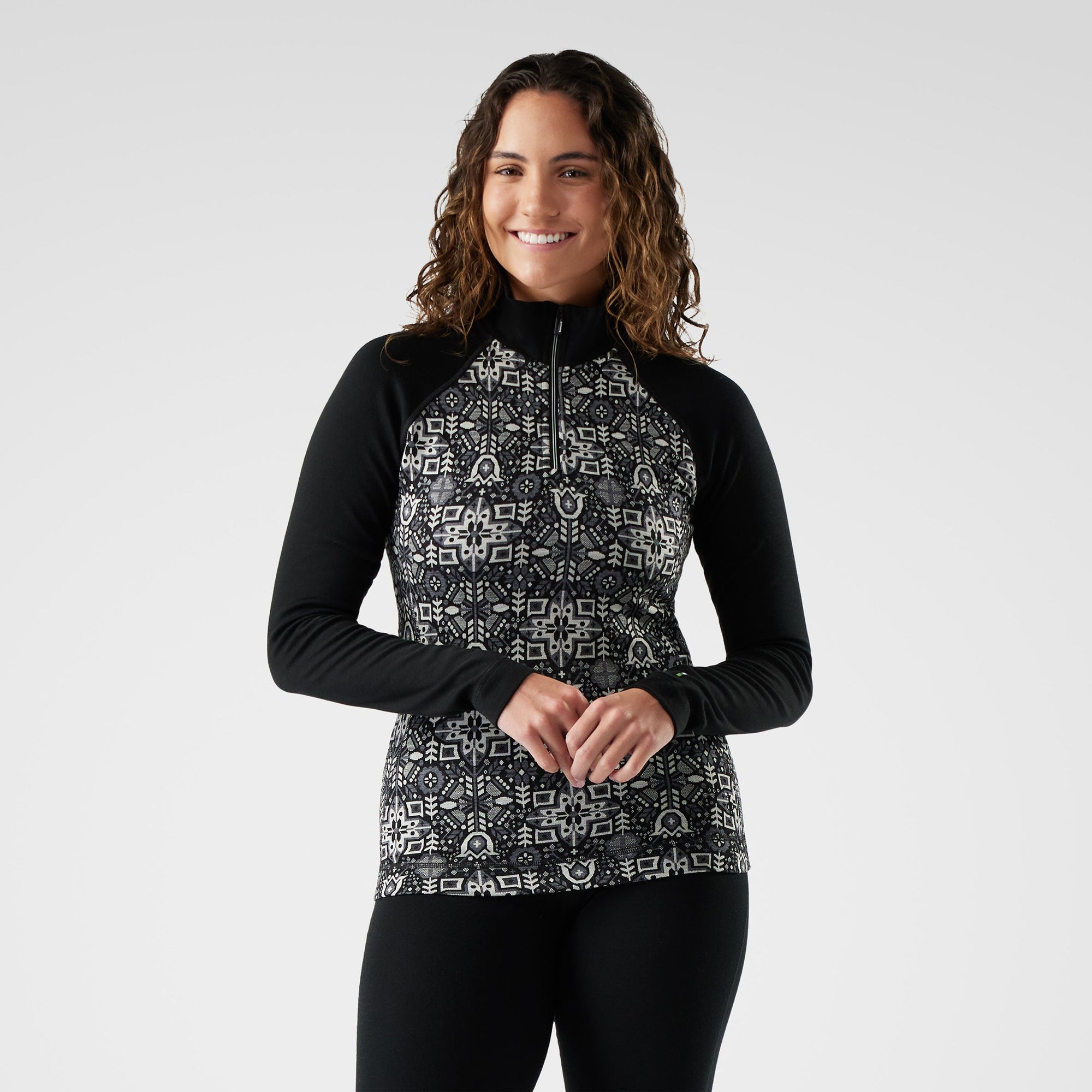 Women's thermal merino quarter-zip pullover with fair isle print front and solid black sleeves, front view