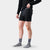 Men's black compression boxer brief shorts with branded waistband, front on-model view