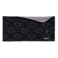 Reversible merino wool headband with black geometric fair isle pattern and gray interior, flat lay view