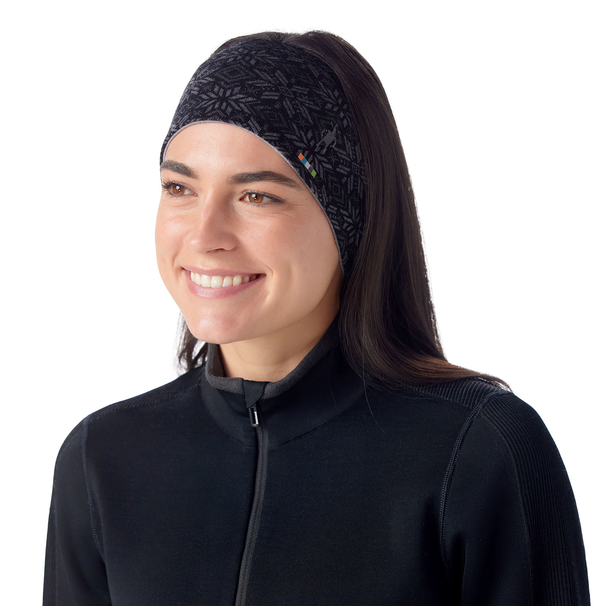 Woman wearing a black Fair Isle patterned knit headband with ponytail, front angle view