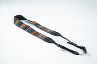 Multicolor woven tapestry camera strap with black adjustable ends and quick-release clips