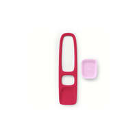 Red sand and beach toy with elongated handle and small pink accessory piece