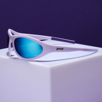Wrap-style sport sunglasses with lavender frame and blue mirrored lenses on white cube