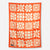 Orange blanket towel with cream floral pattern featuring daisies and flowers in grid layout