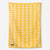 Yellow blanket towel with white sun pattern displayed flat against neutral background