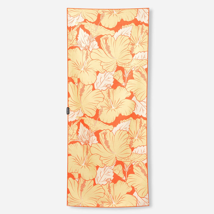 Rectangular towel with tropical hibiscus flower pattern in orange and yellow tones