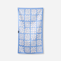 Light blue microfiber towel with repeating white flower pattern arranged in grid