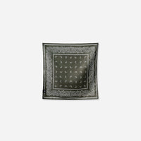 Square bandana towel with paisley border pattern and dotted center, laid flat