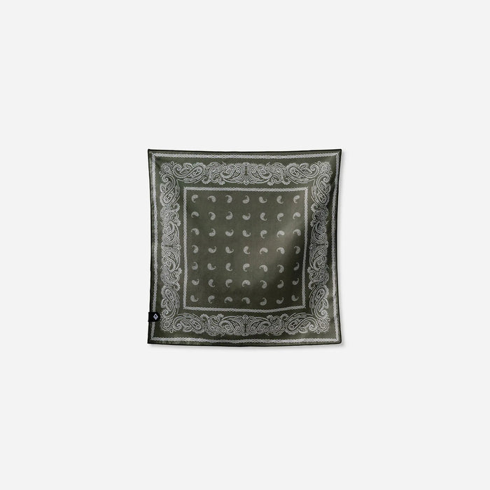 Square bandana towel with paisley border pattern and dotted center, laid flat
