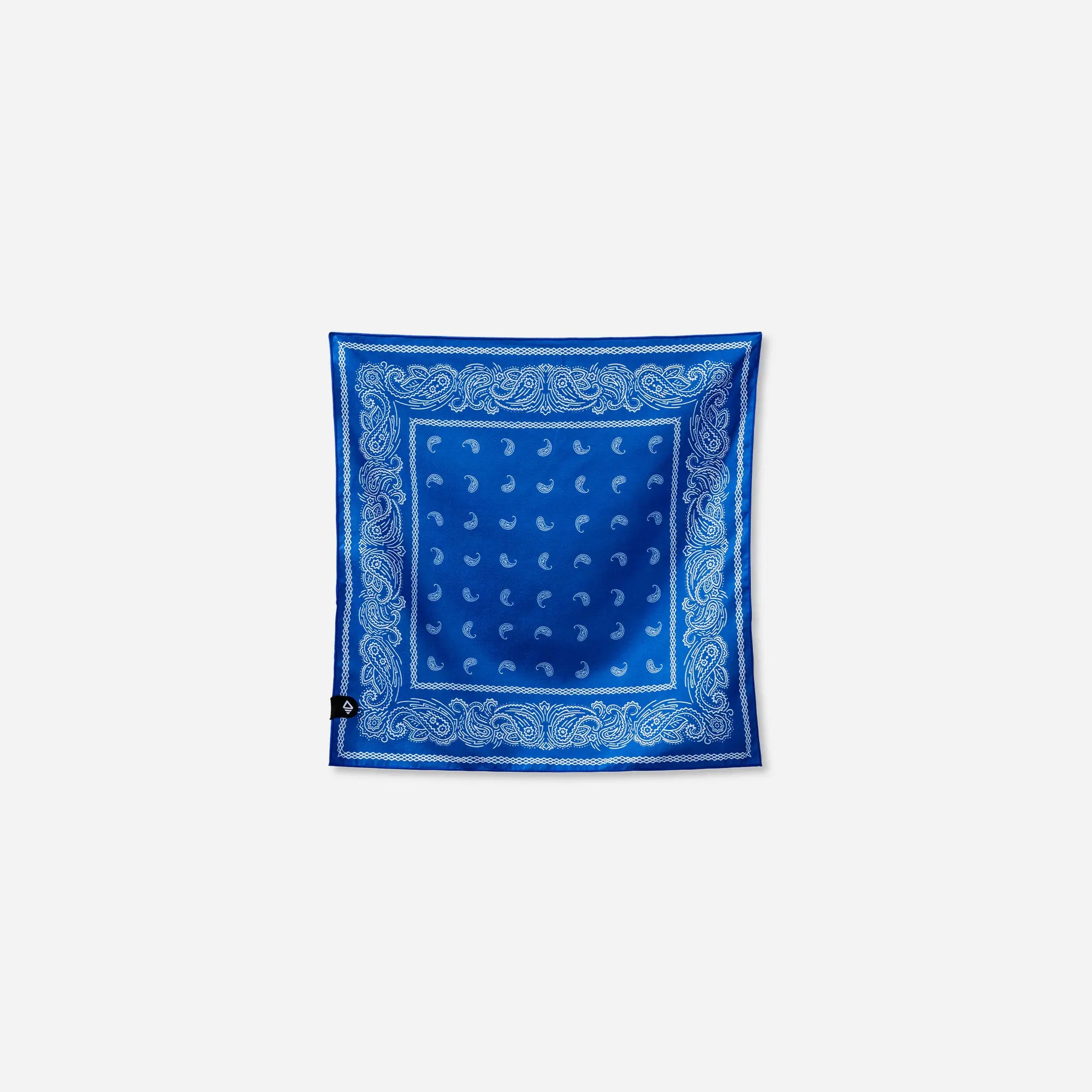 Blue bandana with white paisley border pattern laid flat on white background