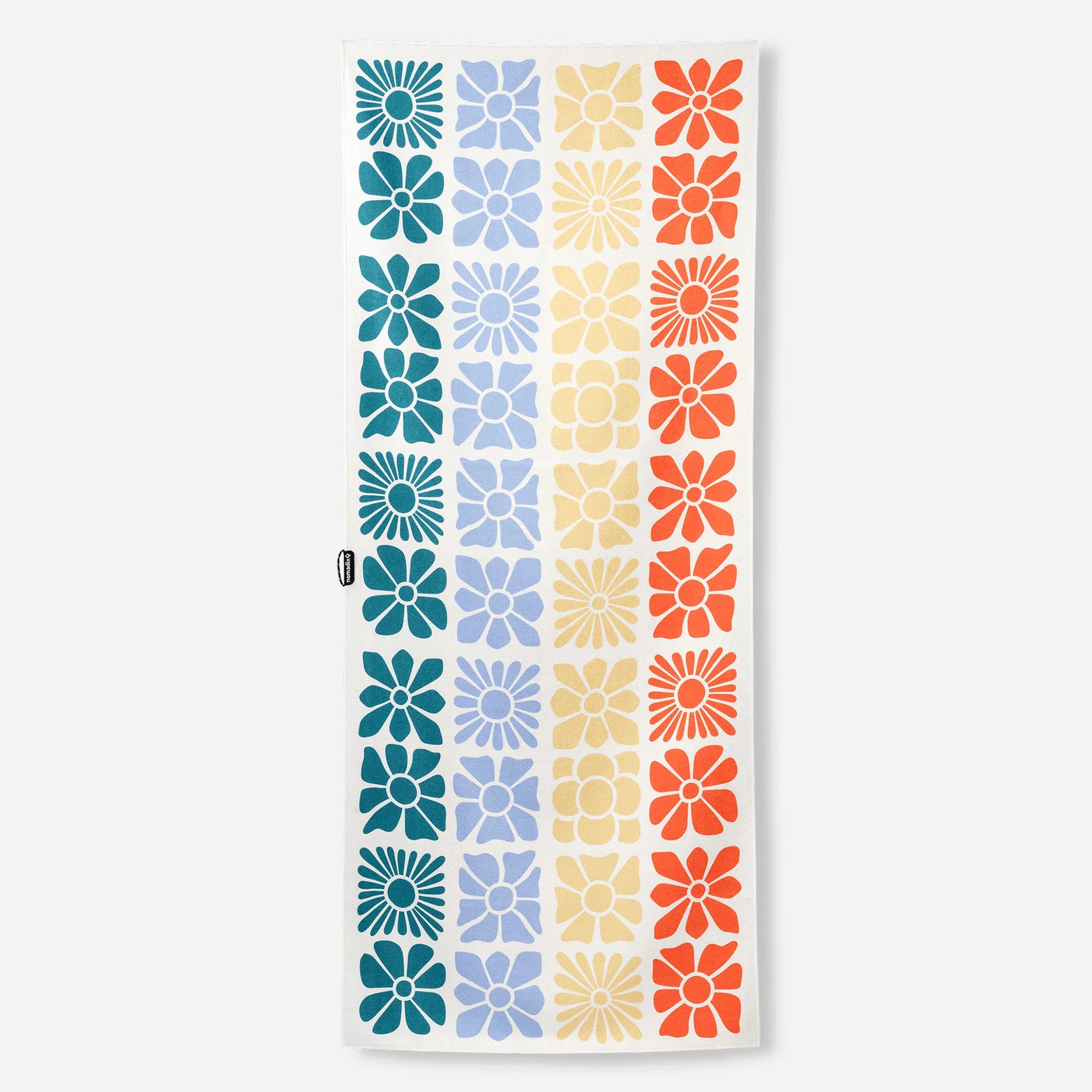 Rectangular towel with colorful geometric flower pattern in grid layout on white background