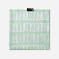 Light green towel with white geometric zigzag pattern displayed flat against white background
